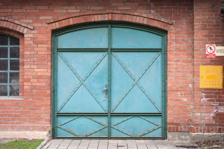 green door for car in the red wallの写真素材