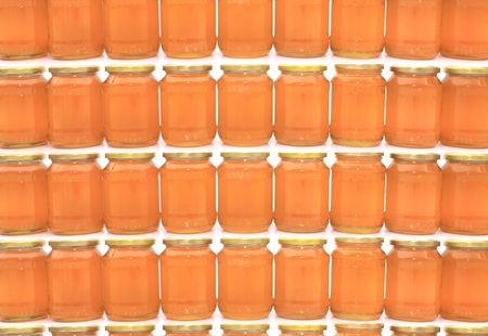 glasses with honey as nice food backgroundの写真素材