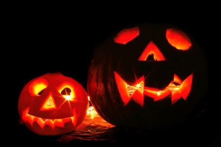 pumkins with ligths in dark halloween symbolの写真素材