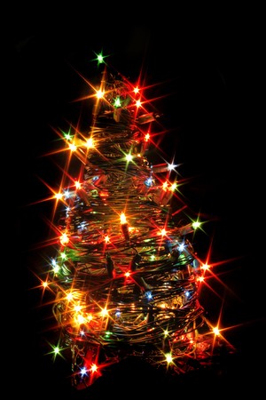 xmas tree from the color lights on the black backgroundの写真素材