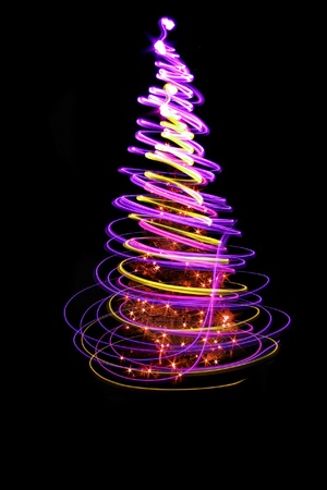 christmas tree form the color lights on the black backgroundの写真素材
