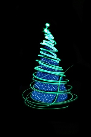 christmas tree form the color lights on the black backgroundの写真素材