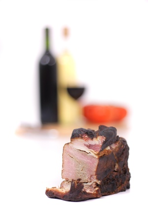 wine and smoked meat isolated on the white backgroundの写真素材