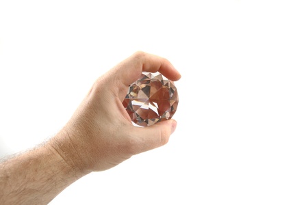 diamond in the hand isolated on the white backgroundの写真素材