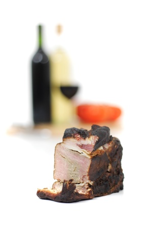 smoked meat and wine isolated on the white backgroundの写真素材