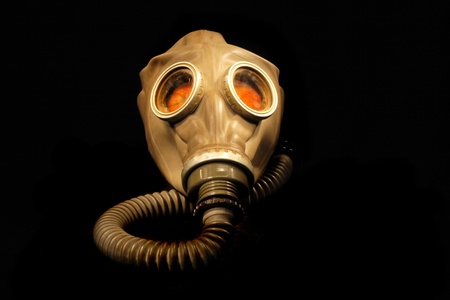 old gas mask isolated on the black backgroundの写真素材