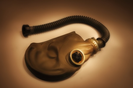 old gas mask isolated on the black backgroundの写真素材