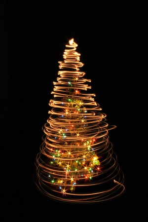 xmas tree isolated on the black backgroundの写真素材