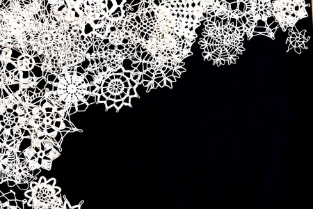 handmade christmas snowflakes on the black  backgroundの写真素材