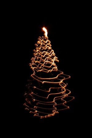 christmas tree frrom the bulb light on the black backgroundの写真素材