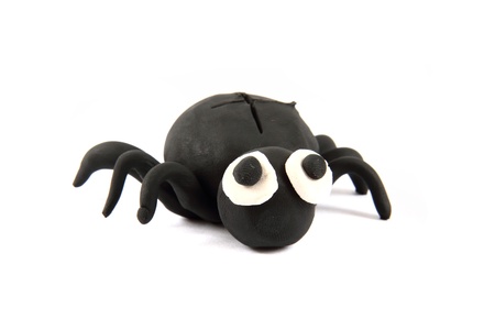 black spider from the plasticine isolated on the white backgroundの写真素材