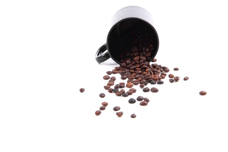 coffee beans in the black pot isolated on the white backgroundの写真素材