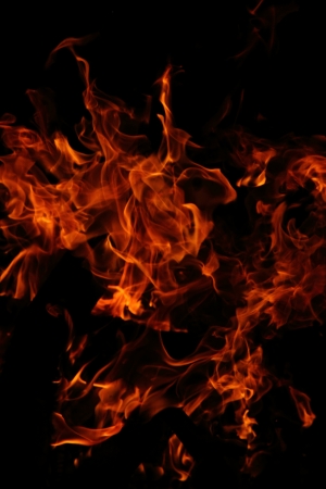 red and orange fire isolated on the black background