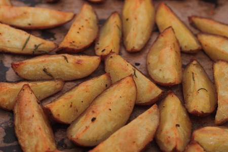 fried potatoes as very nice and fresh food bacgroundの写真素材