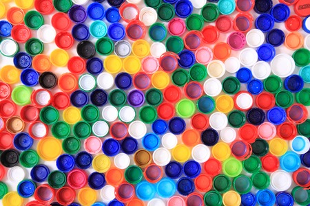 color plastic caps from pet bottles as recycle background