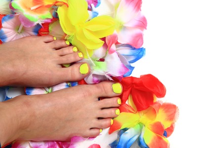 women feets and flowers as nice pedicure backgroundの写真素材