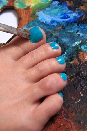 women feet and colors as nice pedicure backgroundの写真素材