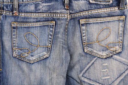 old blue jeans as nice fashion background