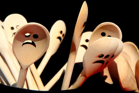 sponns with smiles as very nice kitchen backgroundの写真素材