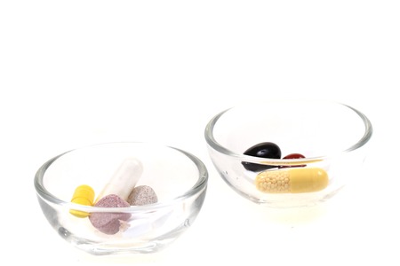 duifferent color pills isolated on the white background
