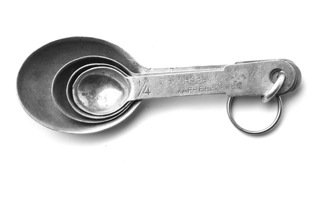 old aluminum spoon set isolated on the white backgroundの写真素材