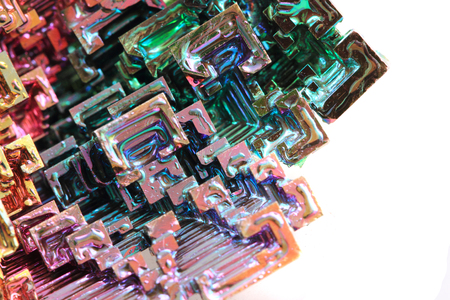 Bismuth - rainbow metal isolated on the white backgroundの写真素材