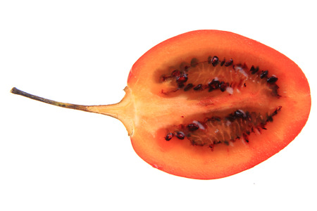 half of tamarillo fruit isolated on the white backgroundの写真素材
