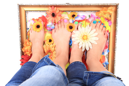 nice legs with pedicure isolated on the white backgroundの写真素材