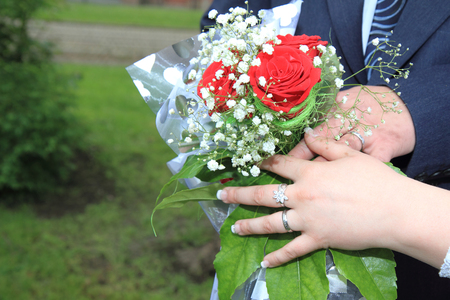 wedding rose decoration in human hands as nice backgroundの写真素材