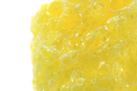 yellow sulphur mineral isolated on the white backgroundの写真素材