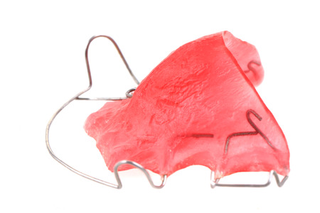 pink braces isolated on the white backgroundの写真素材