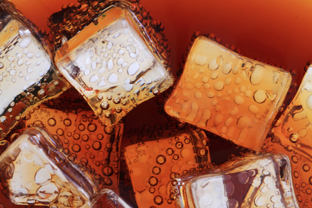 cola drink with ice cubes texture as nice backgroundの写真素材