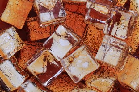 cola drink with ice cubes texture as nice backgroundの写真素材