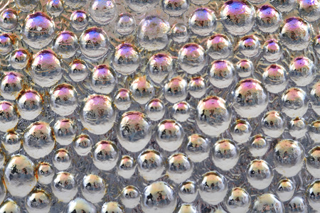 abstract water rainbow drops on the glass as background