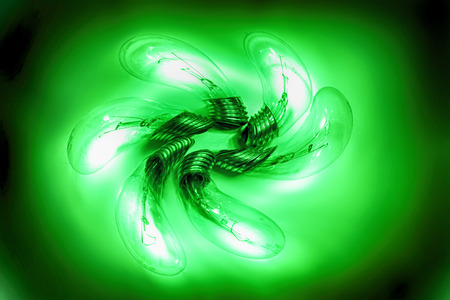 six green light bulbs in the dark nightの写真素材