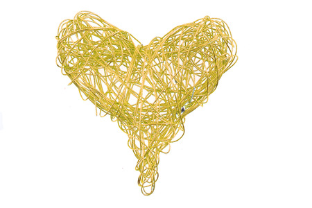 golden heart from wire isolated on the white background