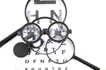 optic test and different magnify glasses isolated on the white backgroundの写真素材