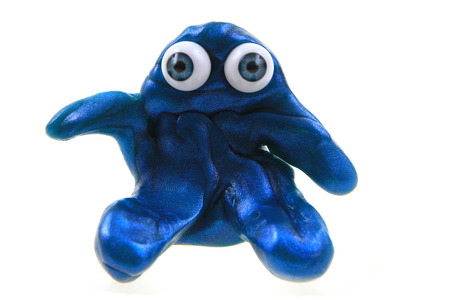 plasticine figure with blue eyes isolated on the white background