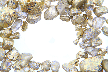 golden decoration stones isolated on the white backgroundの写真素材