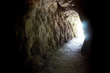 cave entry from the dark as nice backgroundの写真素材