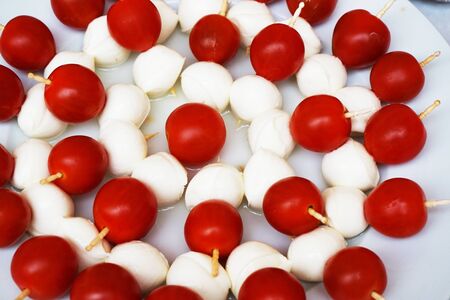 tomato and mozzarella appetizer as very nice food backgroundの写真素材