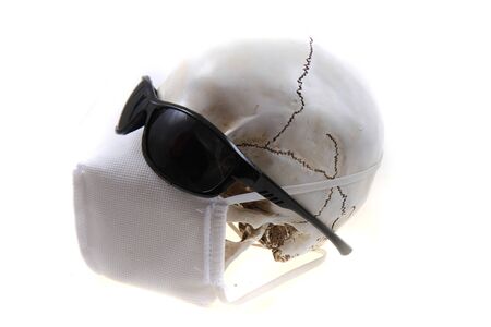 human skull with respirator isolated on the white backgroundの写真素材