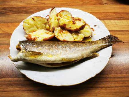 trout fish and potatoes as great gourmet food