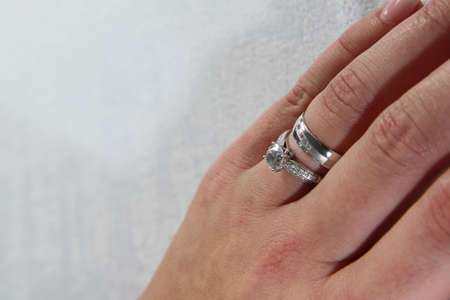 wedding ring on the woman hand as nice backgroundの写真素材