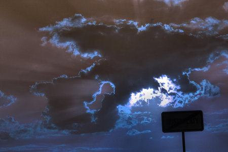 clouds and the moon in the night on the road