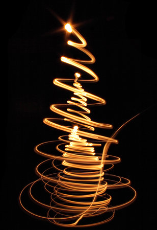 abstract christmas tree painted by a lot of color lightsの写真素材