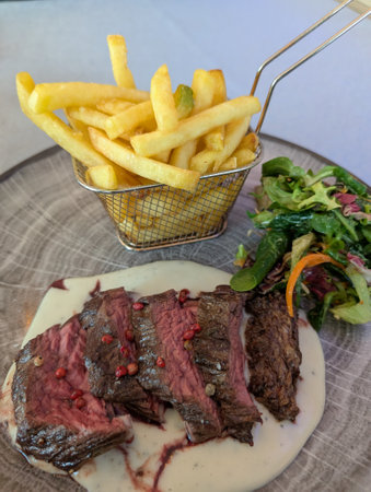 fresh rump steak with vegetables and potato friesの写真素材