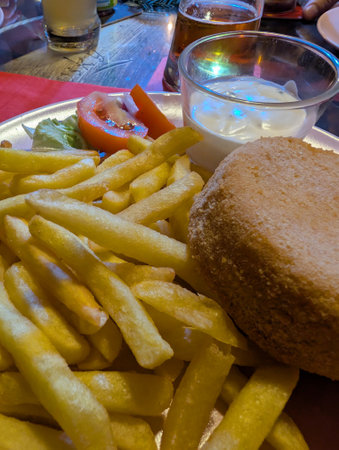 fried camembert cheese and potatoes as nice food backgroundの写真素材