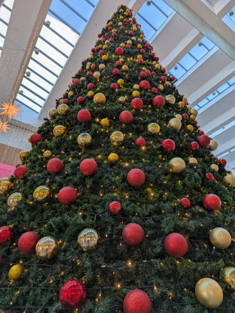 christmas tree texture with decorations and color lightsの写真素材