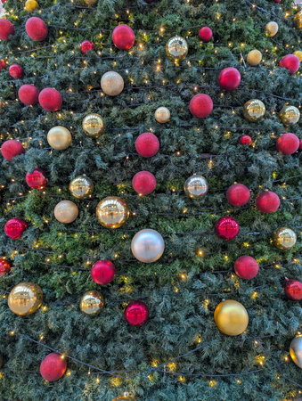 christmas tree texture with decorations and color lightsの写真素材